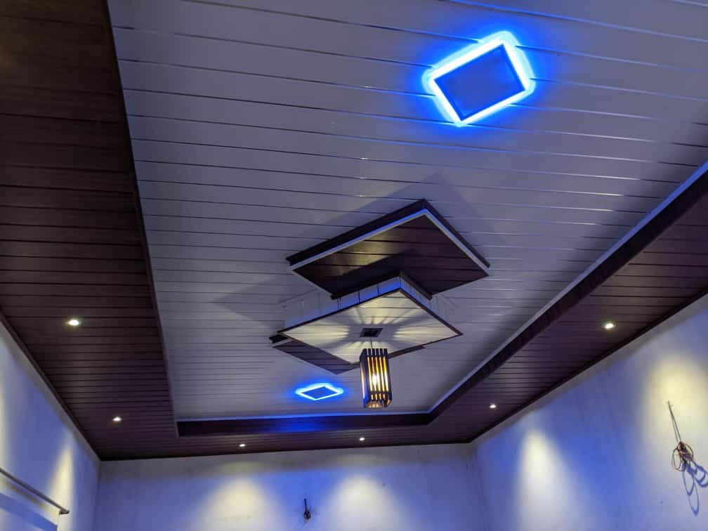 White panel ceiling with recessed round light