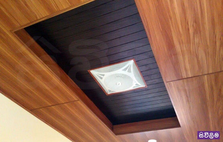 Geometric white and wood false ceiling with colored cove lighting