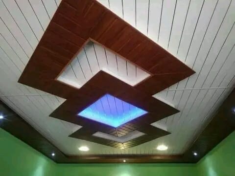 Decorative wood ceiling inset with a central light fitting