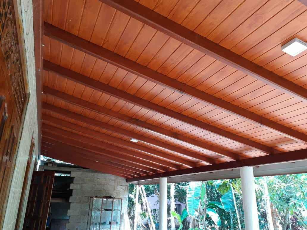 Wood slat ceiling installation over an open veranda