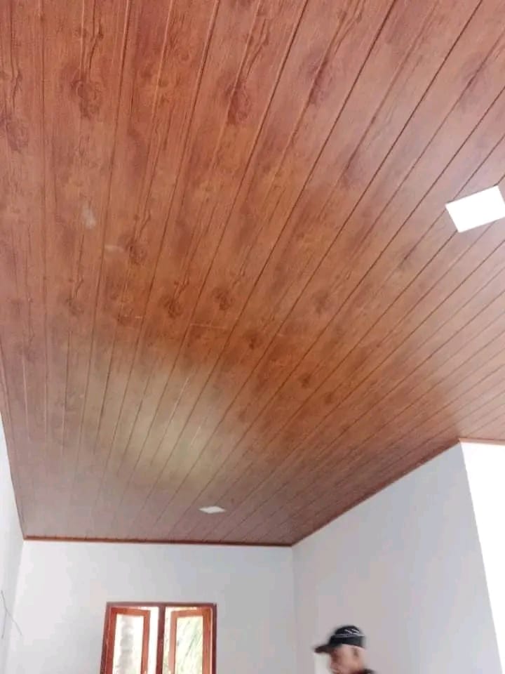 Wood-finish ceiling panels installed in a bright room