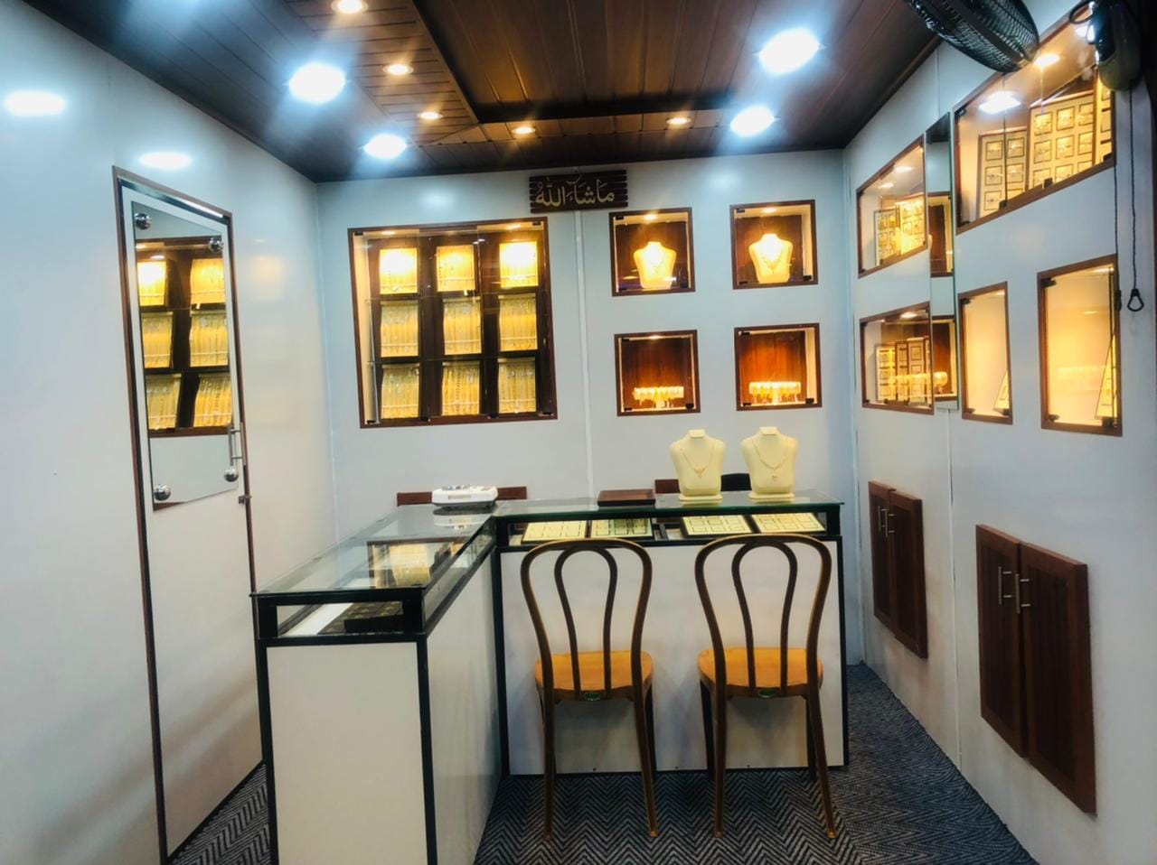 Finished interior with illuminated display niches and ceiling lights