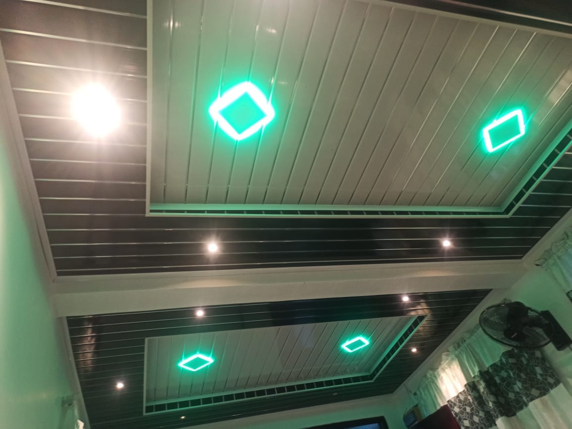 Two-tone ceiling with layered geometric lighting details